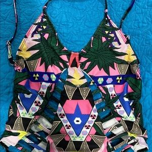 Cut out swimsuit size medium. I love this swimsuit